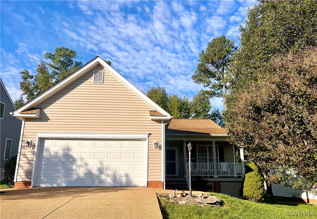 Front facade with a garage and covered porch