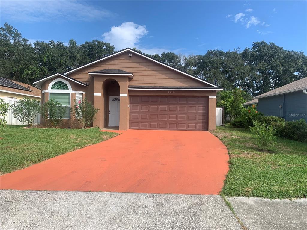 a front view of a house with yard