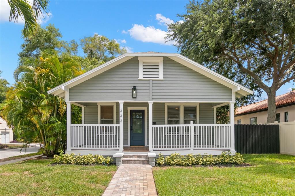 THREE UNITS! 2/1 Main house and two 1/1 garage apartments.  All with their own garage!