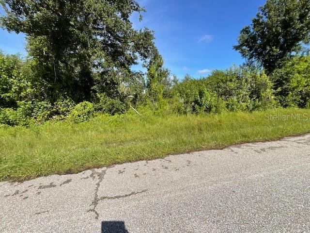 a view of a road with a yard