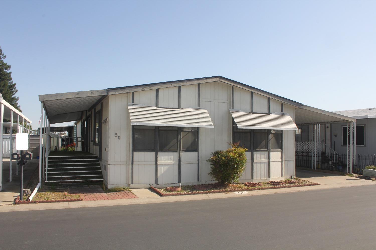 a front view of a house with a garage