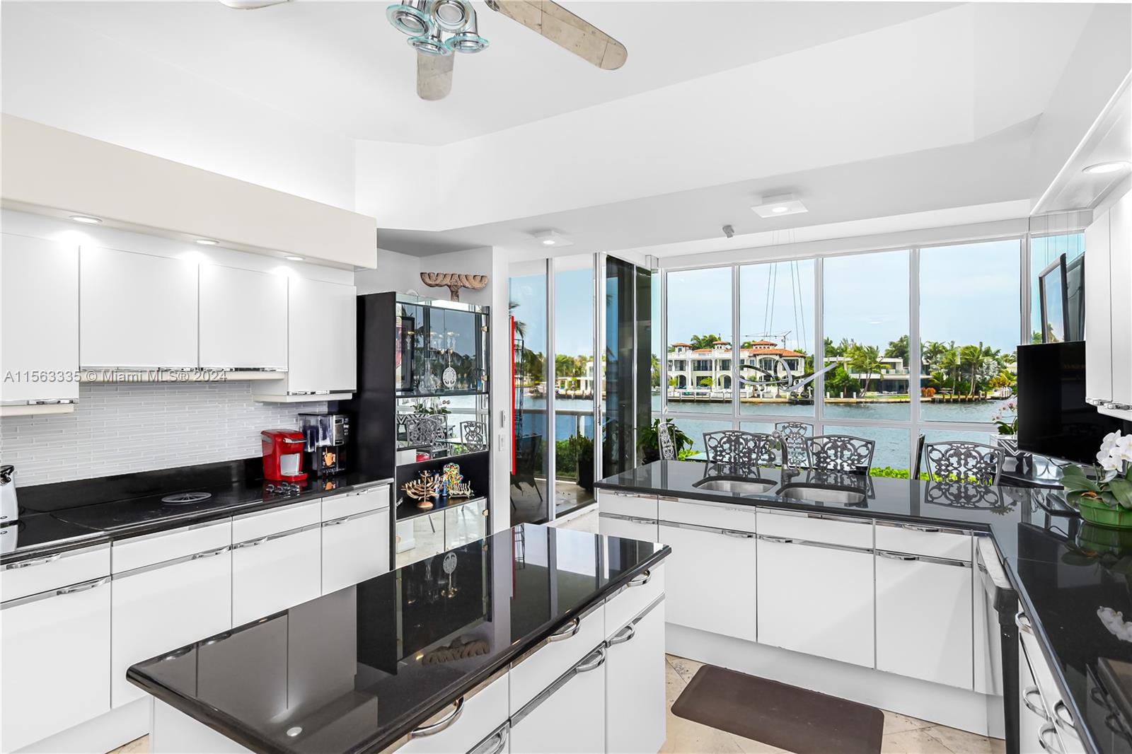 a kitchen with stainless steel appliances a stove a sink and a refrigerator