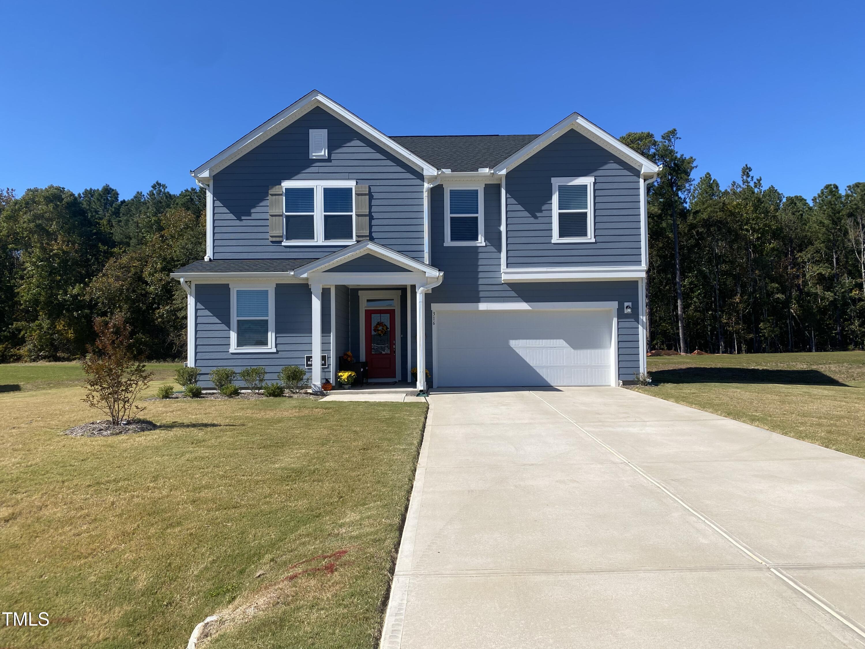 a front view of a house with yard