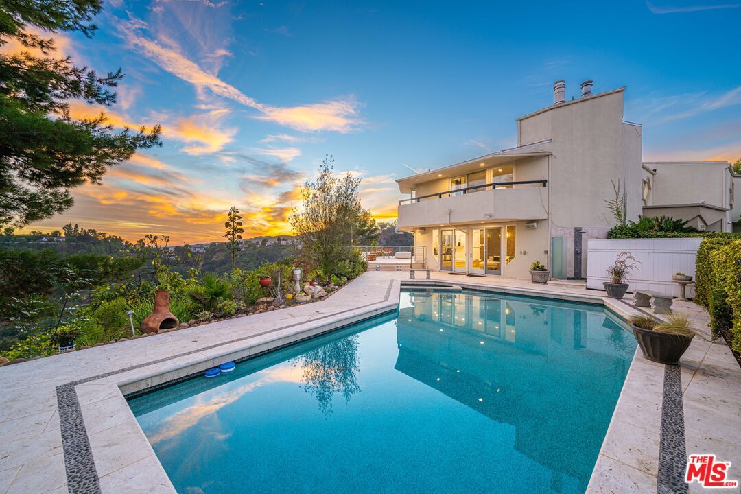 a view of a swimming pool with a patio