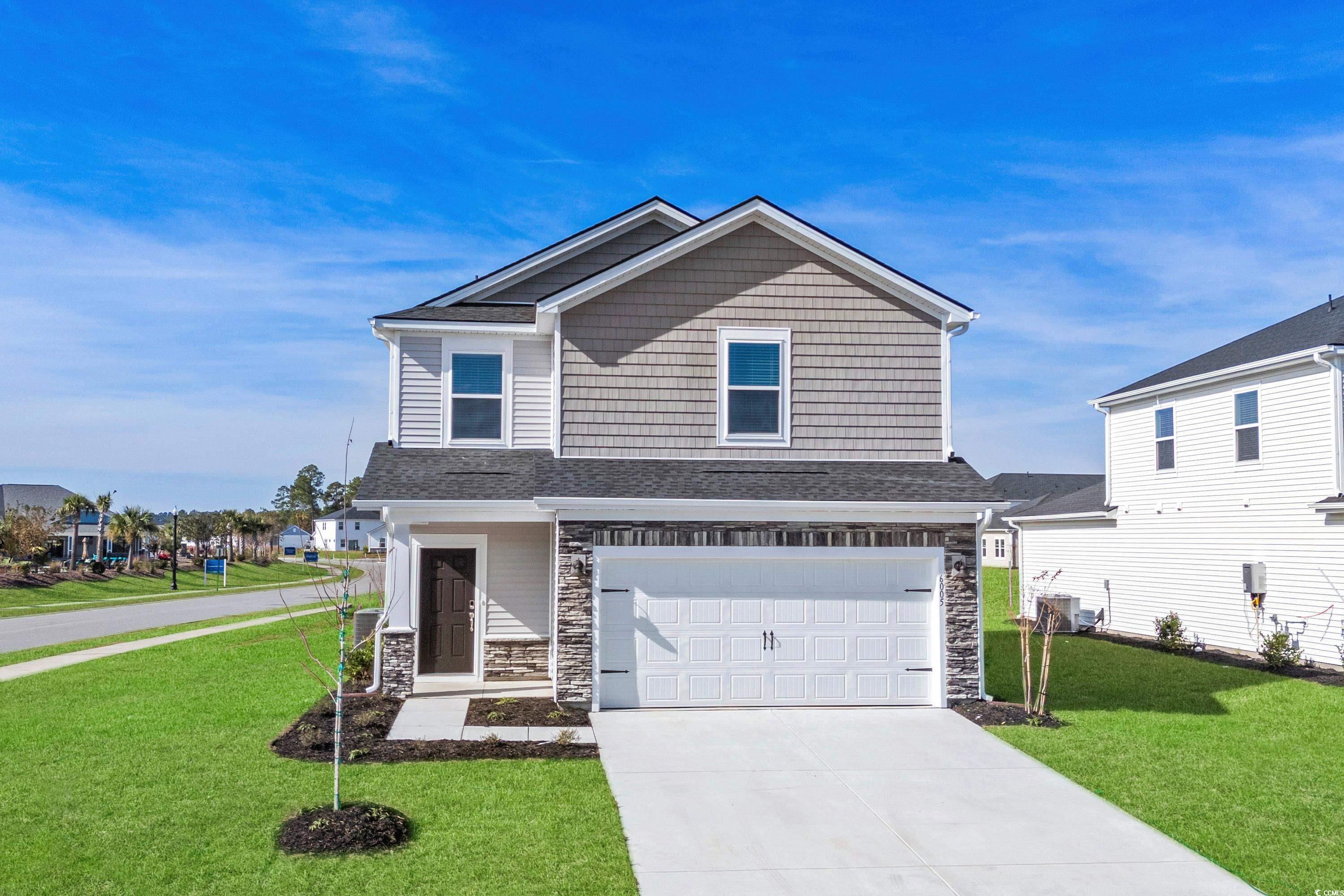 View of front of property featuring central AC, a