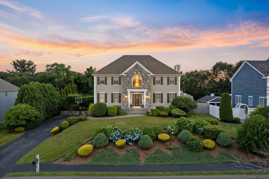 a front view of a house with garden