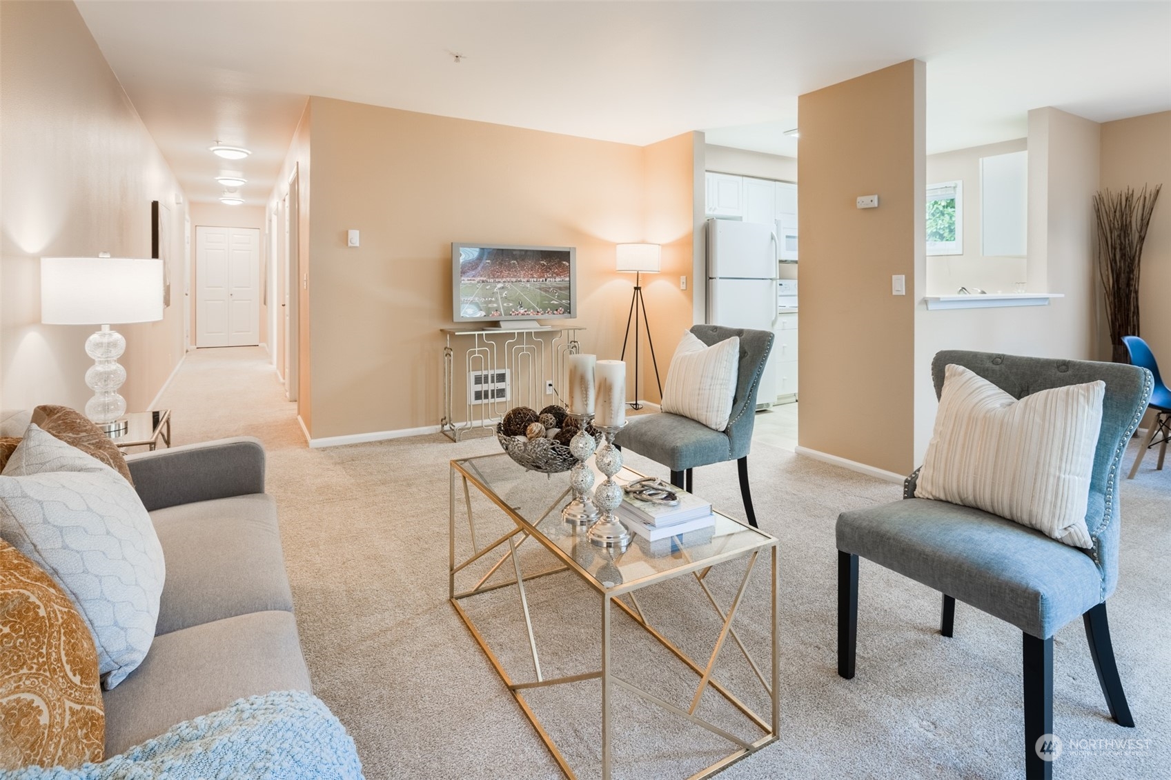 a living room with furniture and a flat screen tv