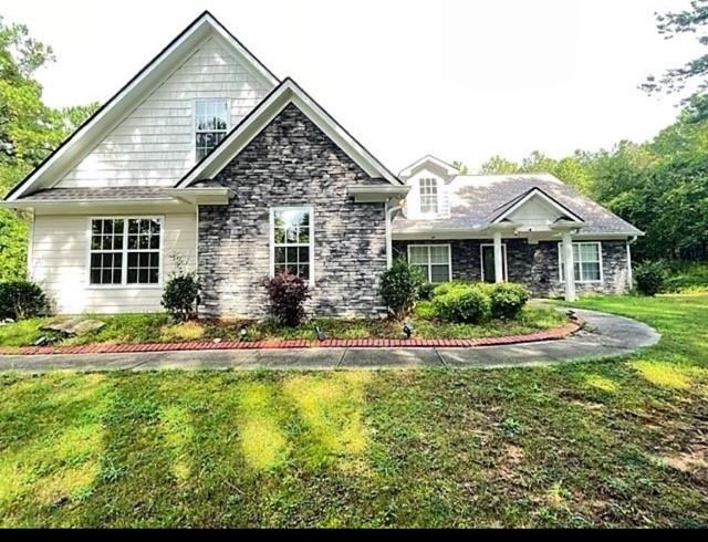 a front view of a house with swimming pool