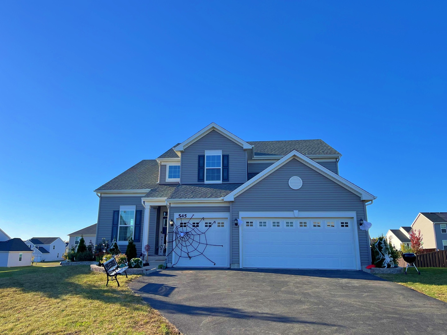 a front view of a house with a yard