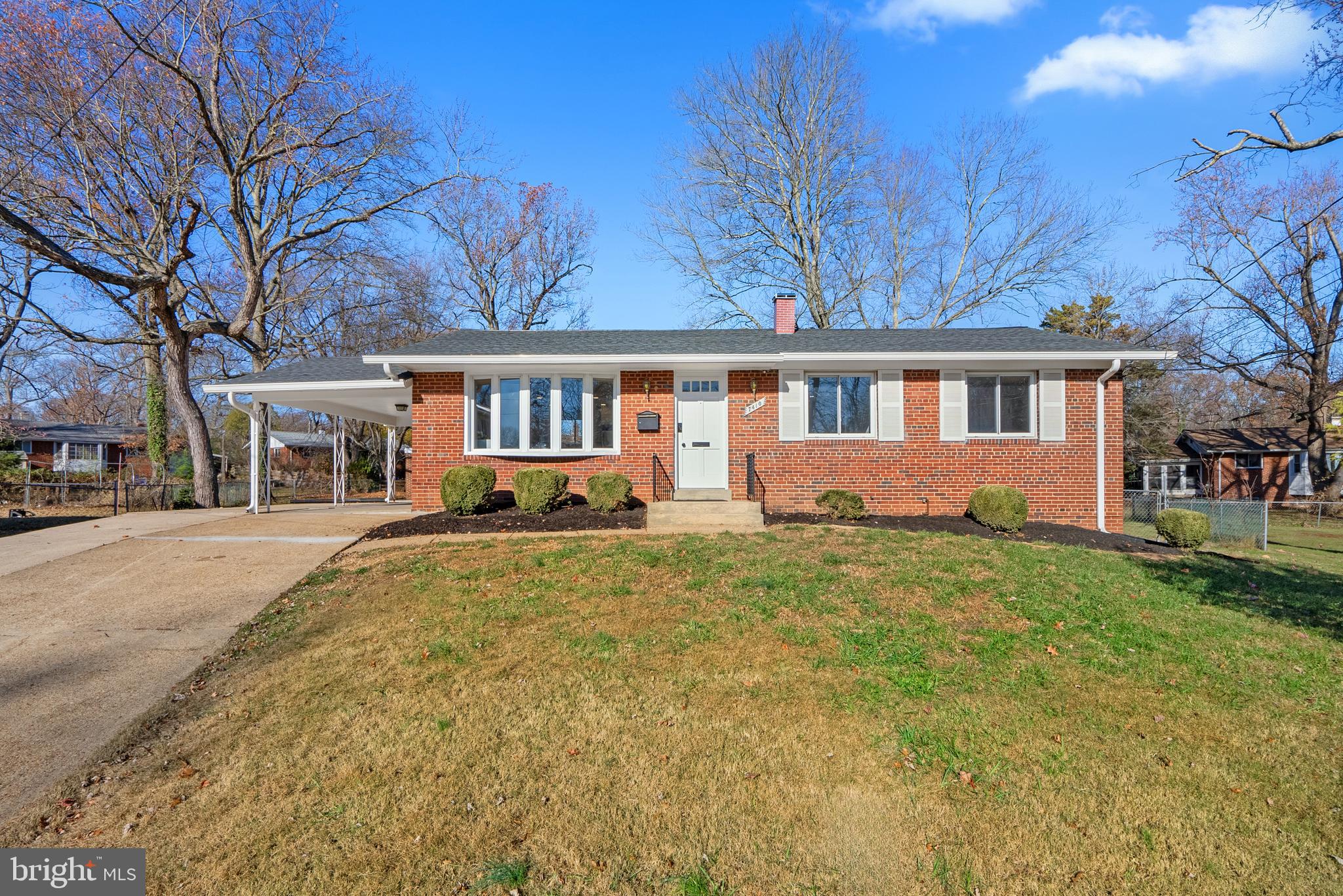 front view of a house with a yard