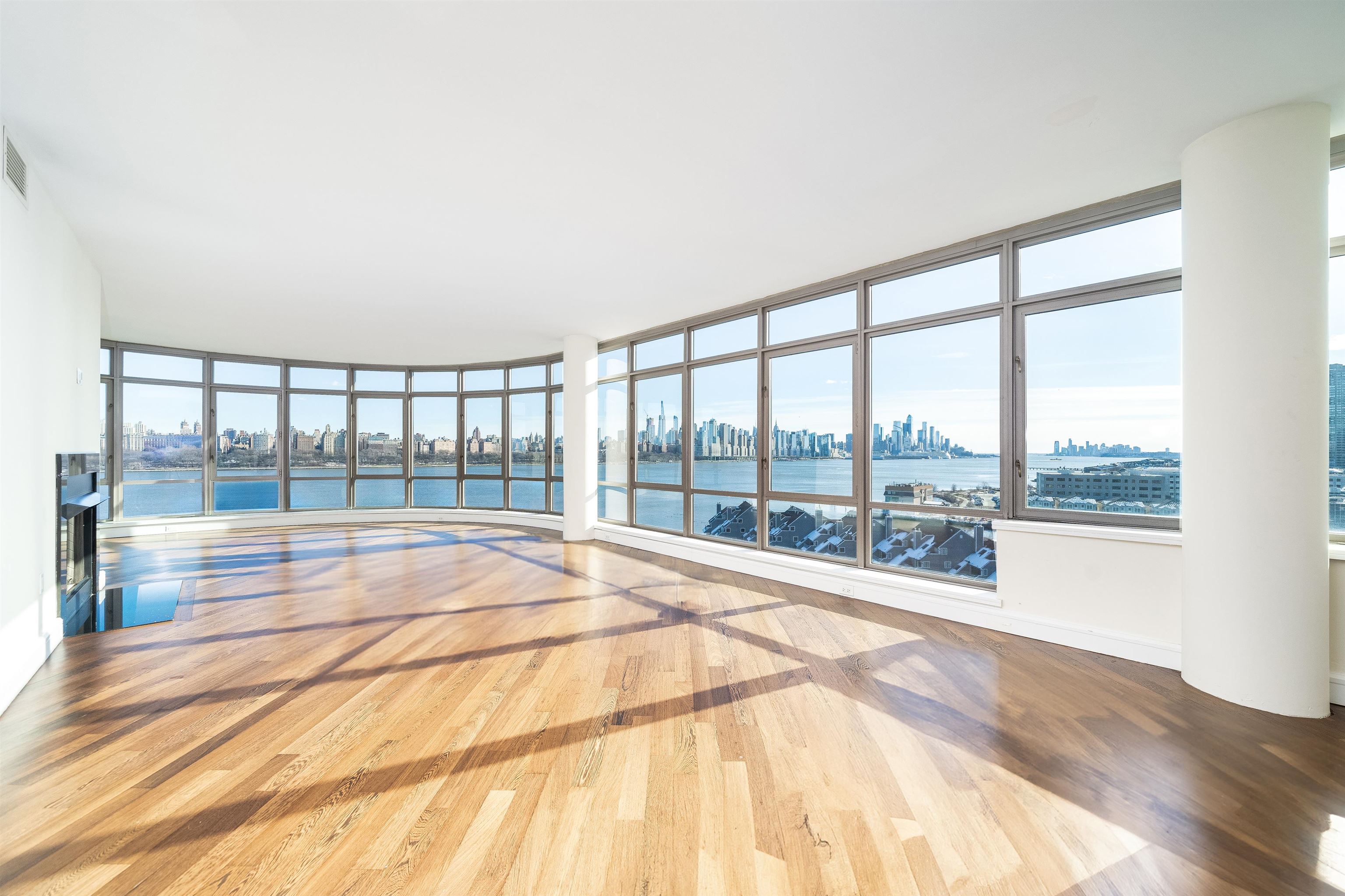 a view of an empty room and a floor to ceiling window