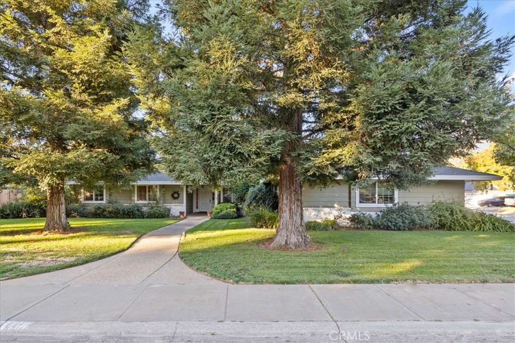 a house view with swimming pool and yard