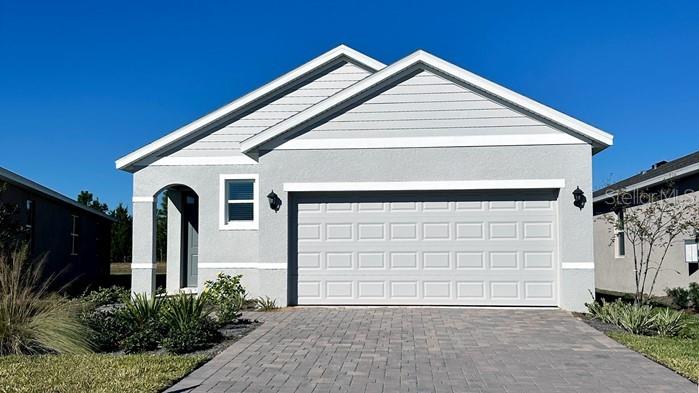 a front view of a house with garage