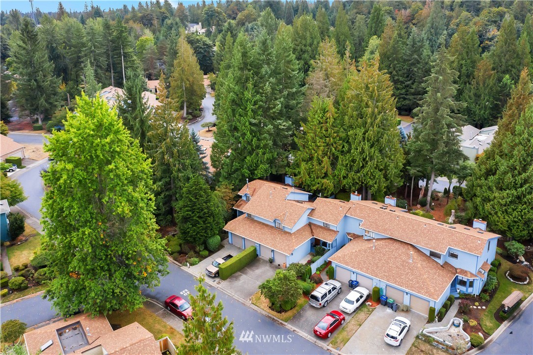 an aerial view of a houses with yard