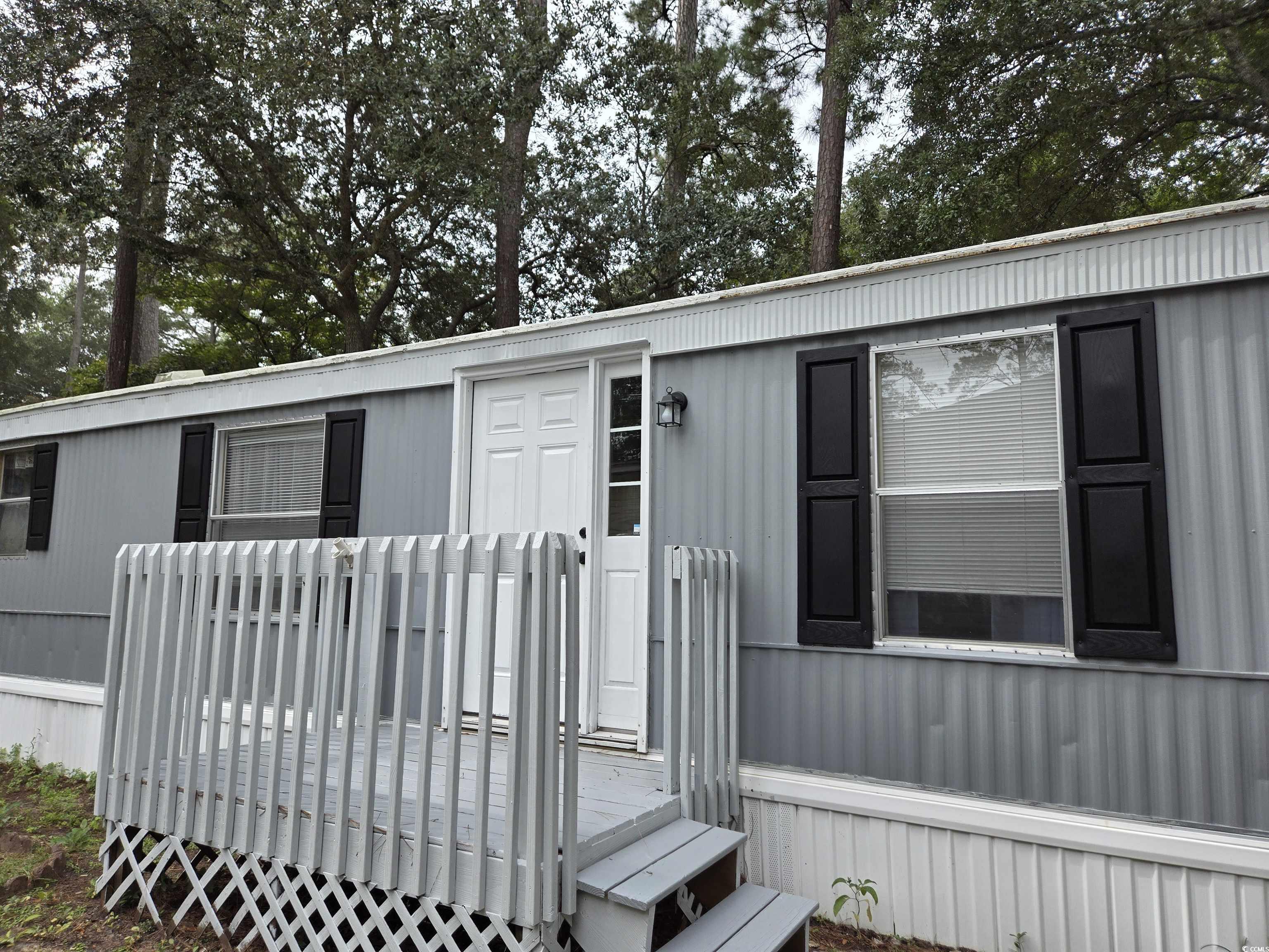 View of front of home with a deck