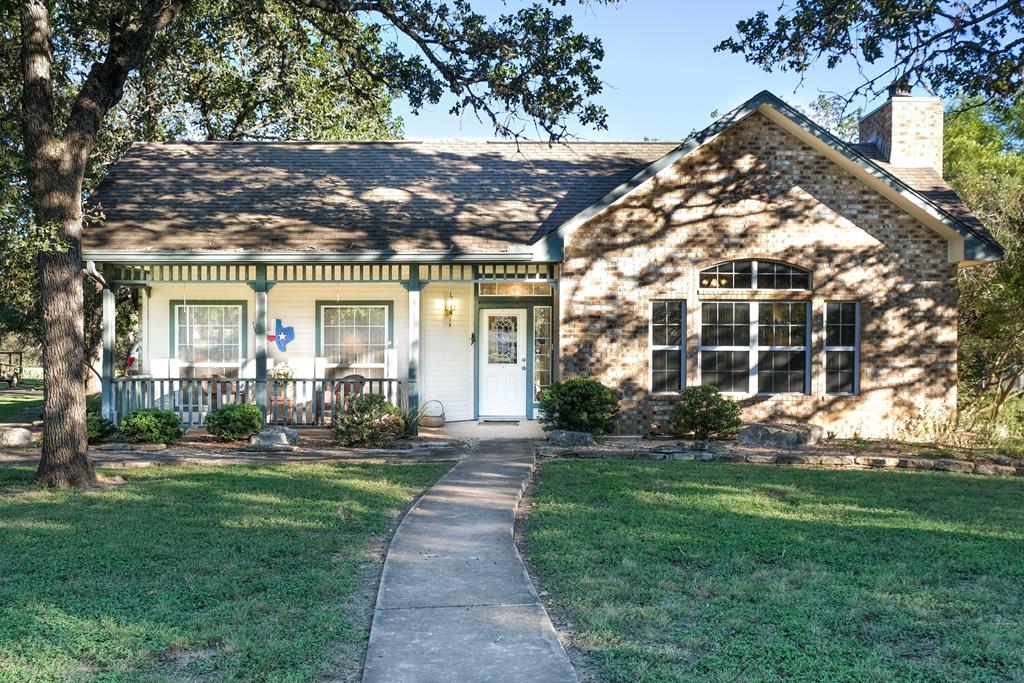 front view of a house with a yard