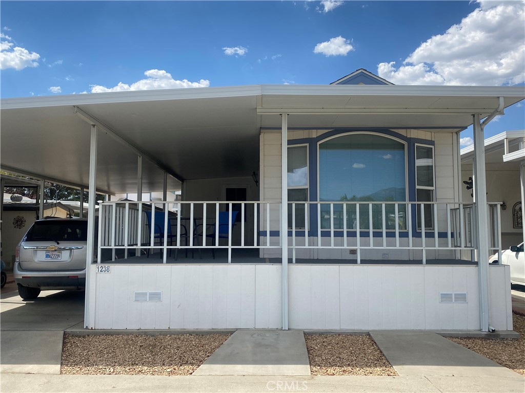 a view of a building with car parked