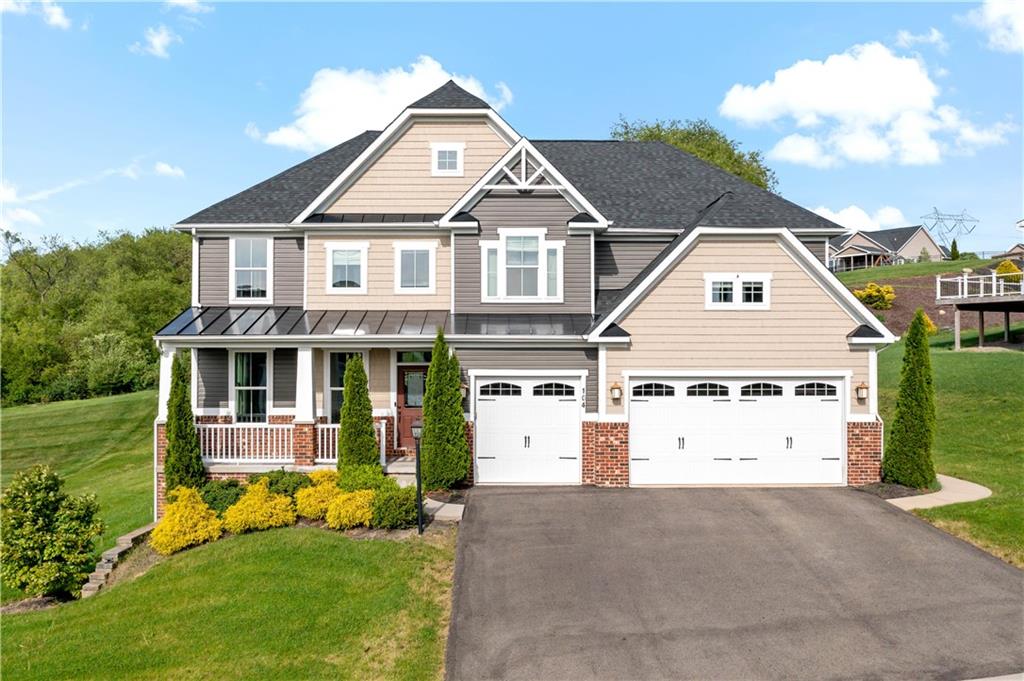 a view of house with yard and entertaining space