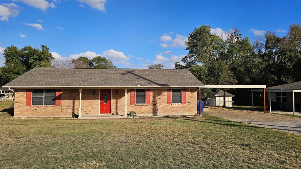 front view of a house with a yard