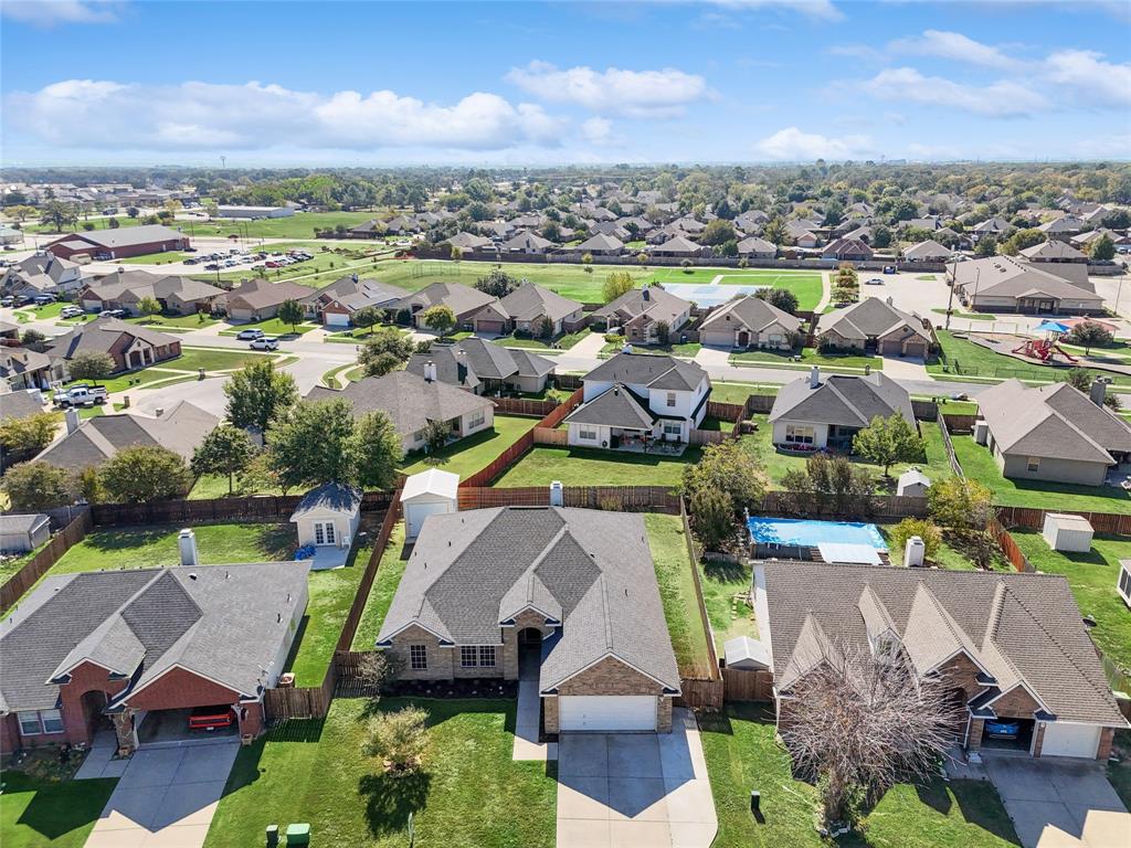 an aerial view of houses with yard