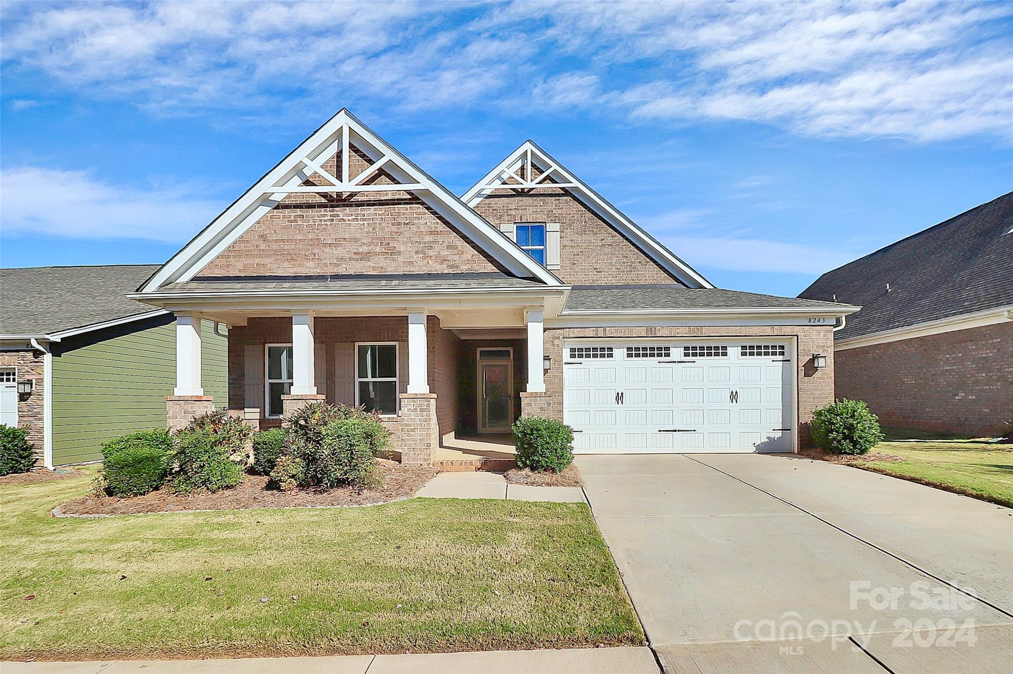 front view of a house with a yard