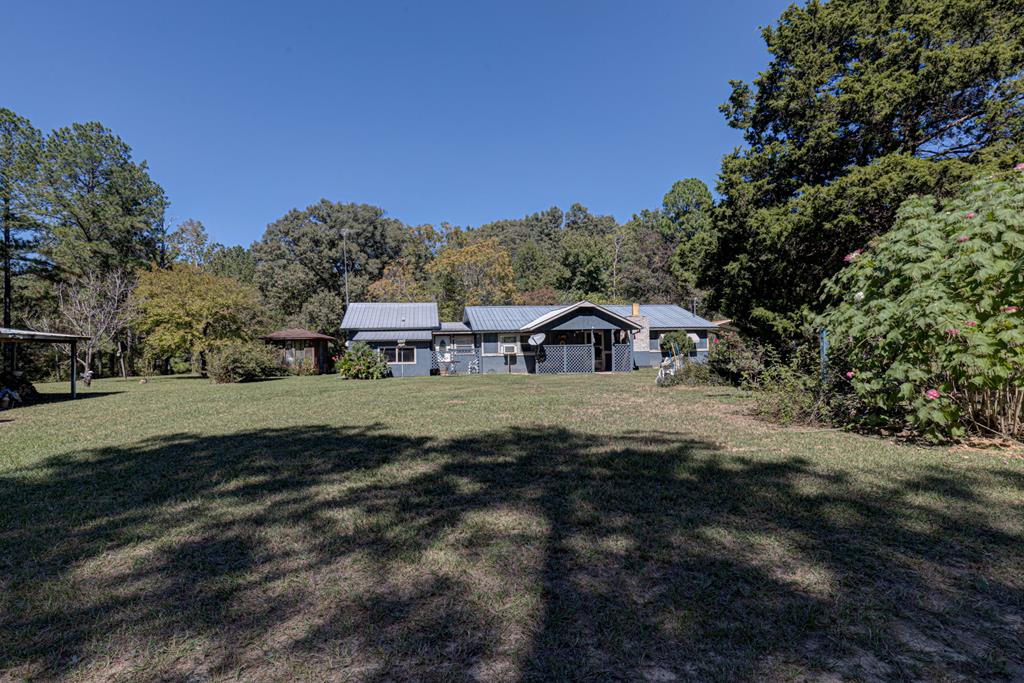 a view of house with outdoor space