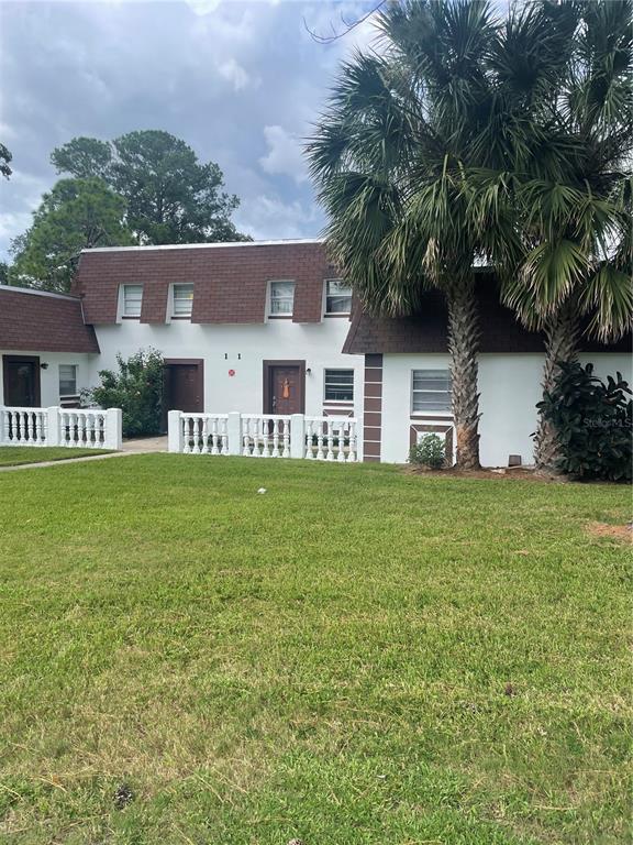 front view of a house with a yard