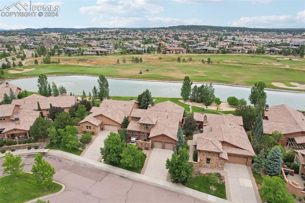 an aerial view of a house with a lake view