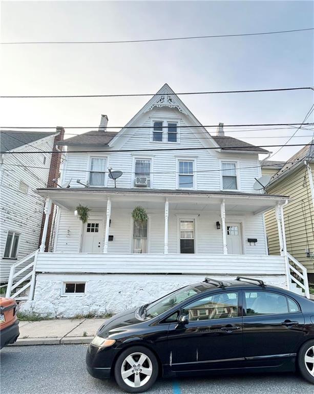 a car parked in front of a house