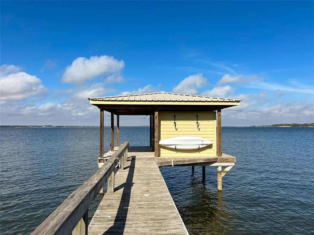 a view of a balcony with two chairs and a table