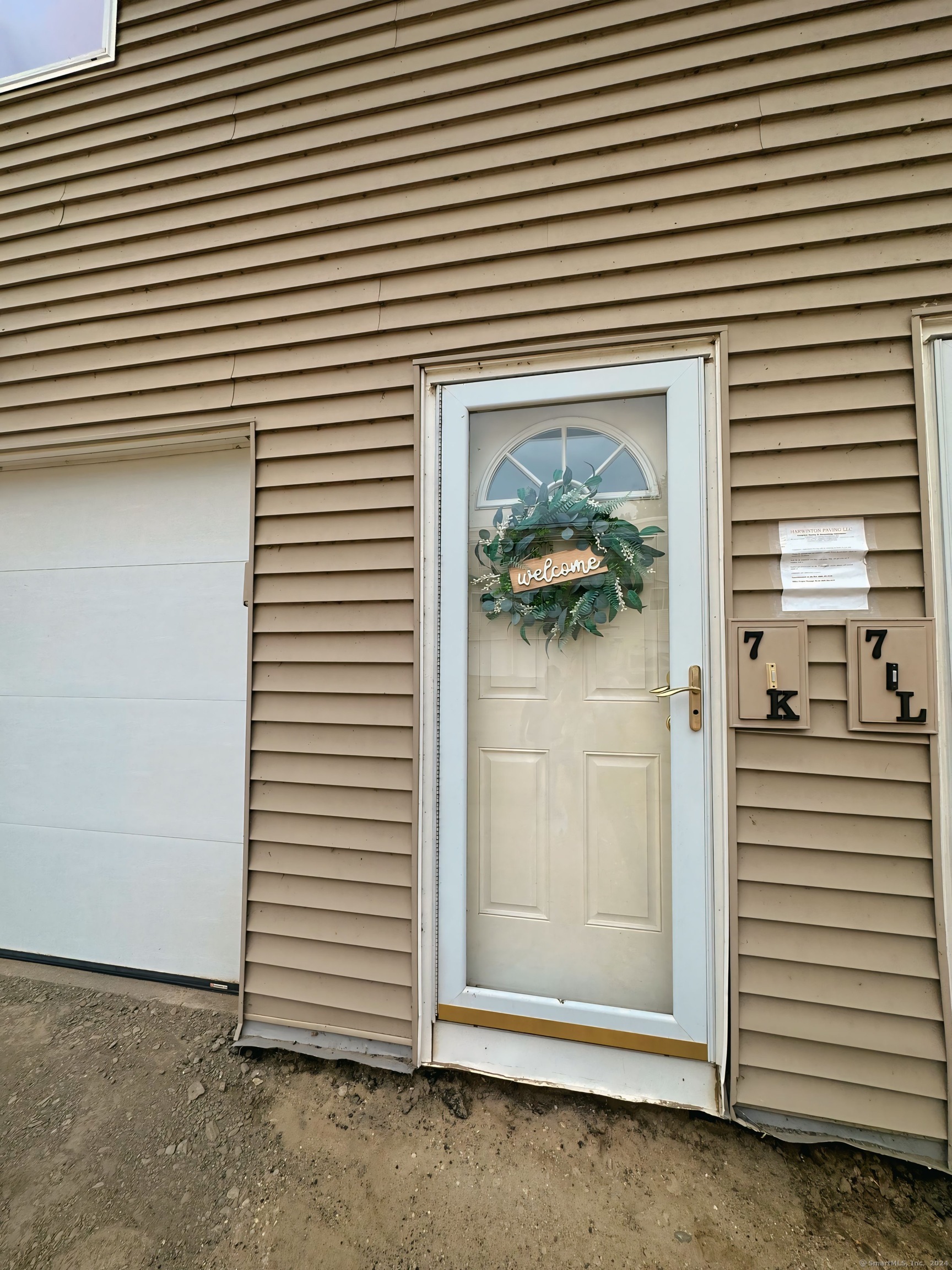 a view of a door and a garage