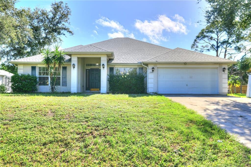 front view of a house with a yard