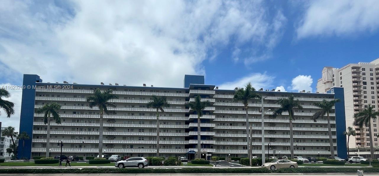 a view of a building with a street