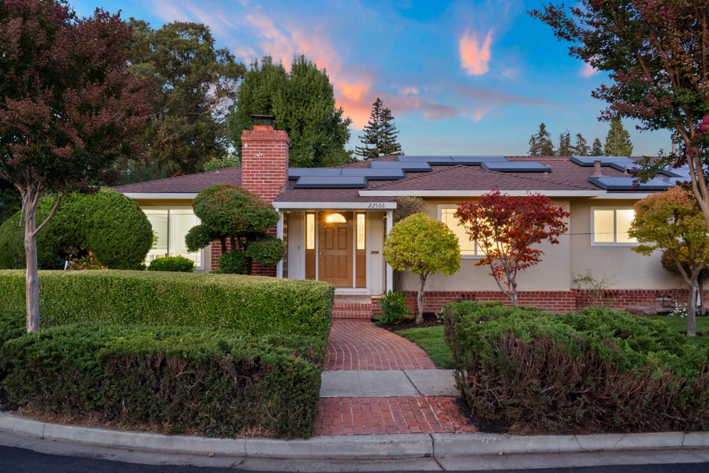 a front view of a house with garden