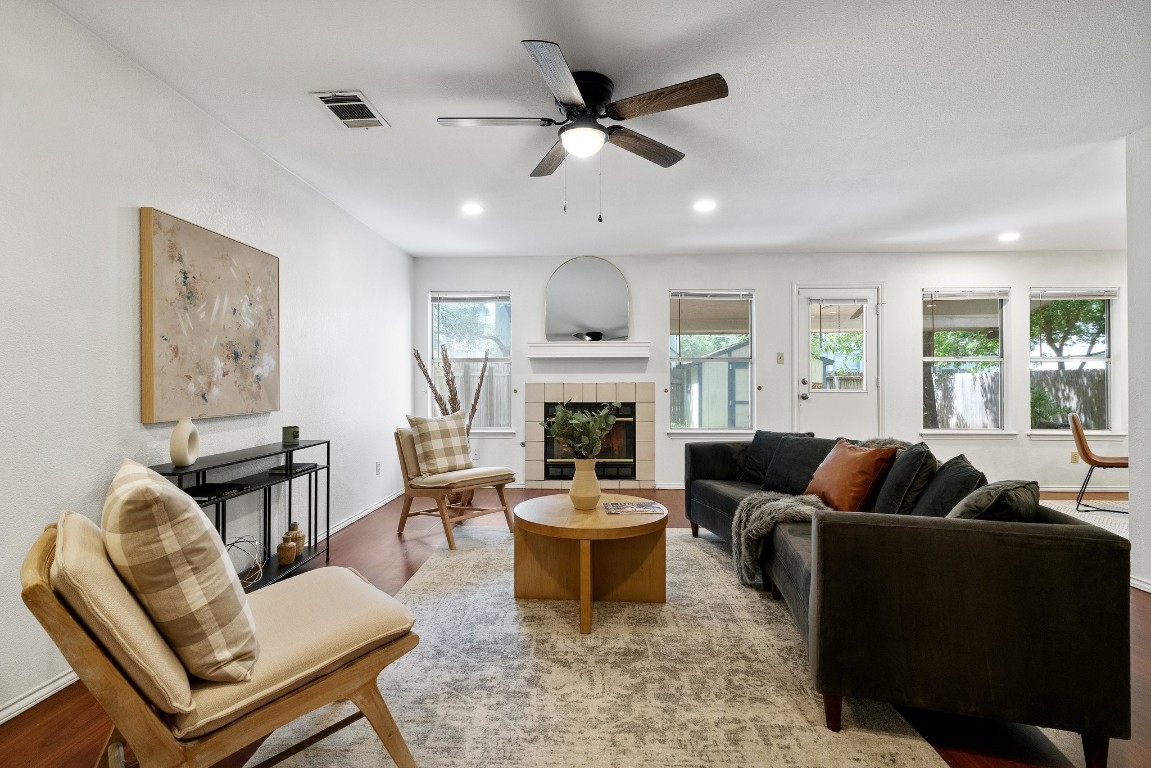 a living room with furniture fireplace and window