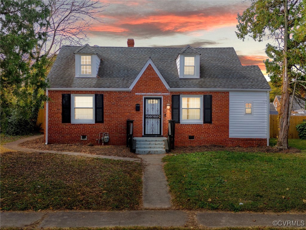 Cape cod-style brick-front house