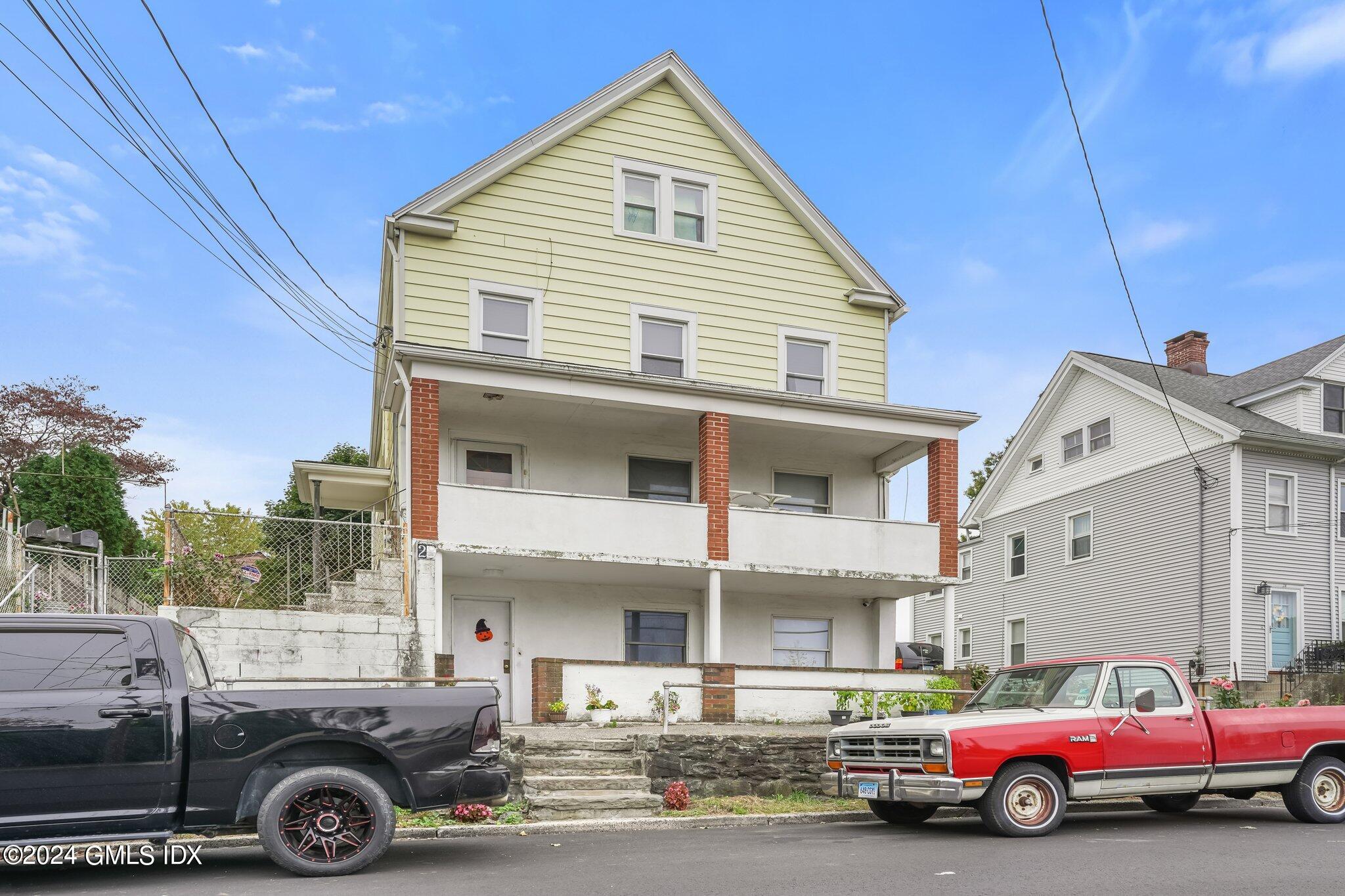 a view of a car parked in front of a house