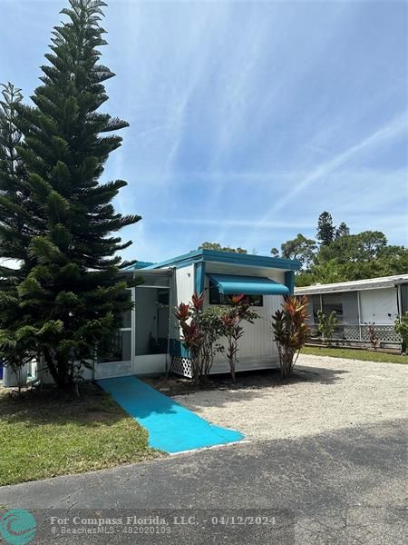 an outdoor view of house with yard