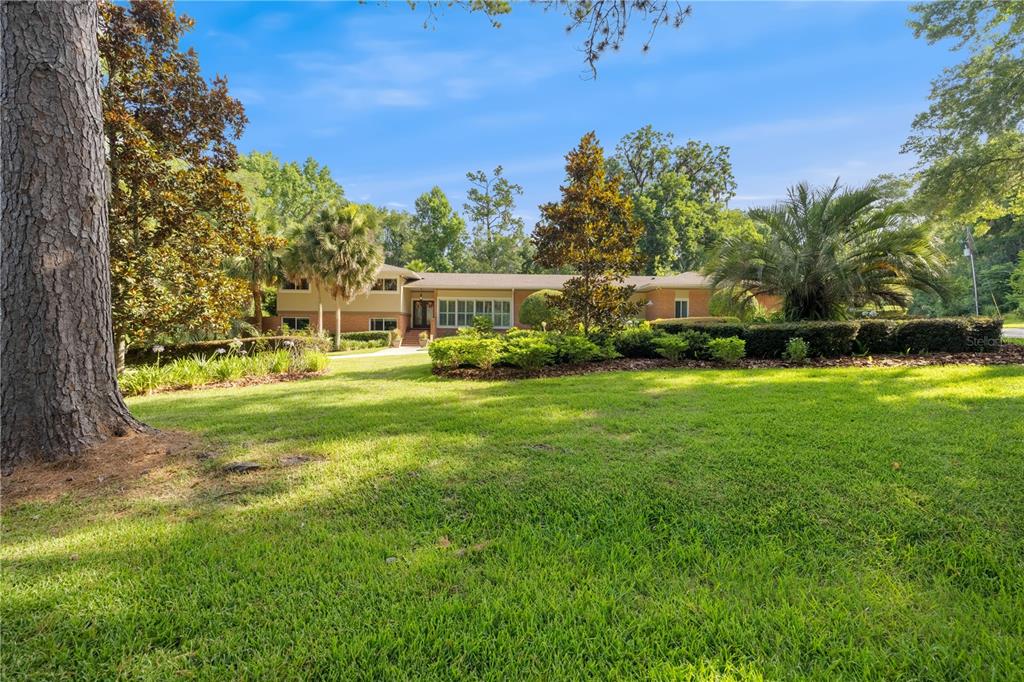 a view of a house with a big yard