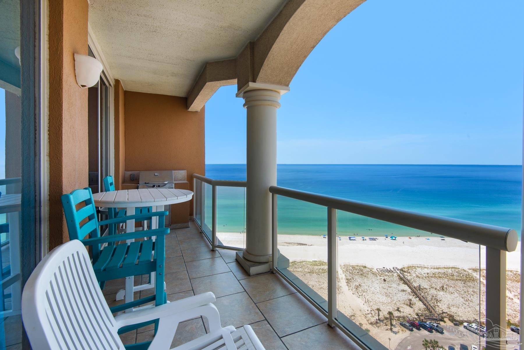 a view of a balcony with chairs