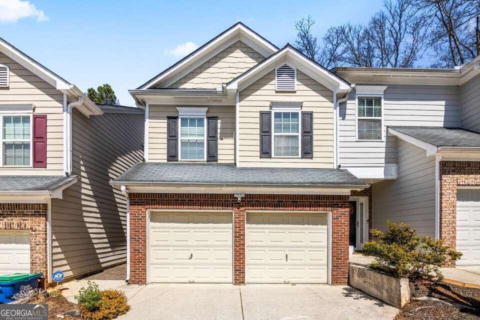 a front view of a house with a garage