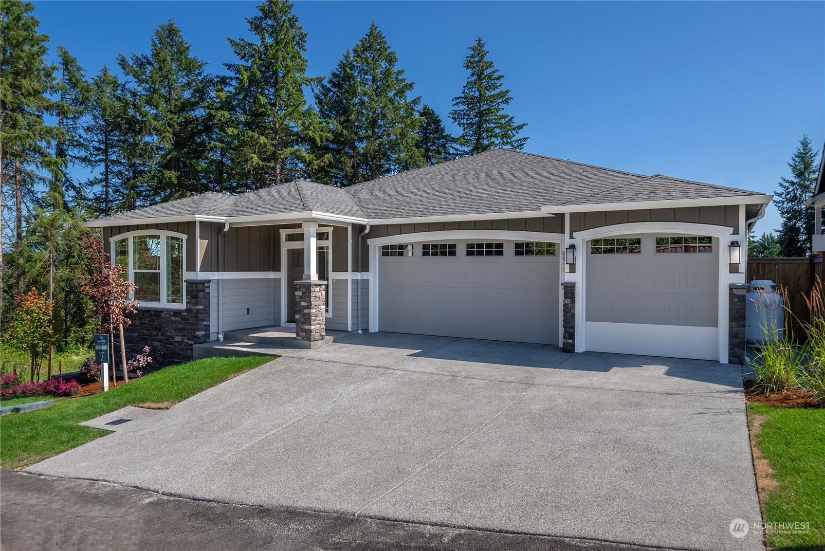 front view of a house with a yard