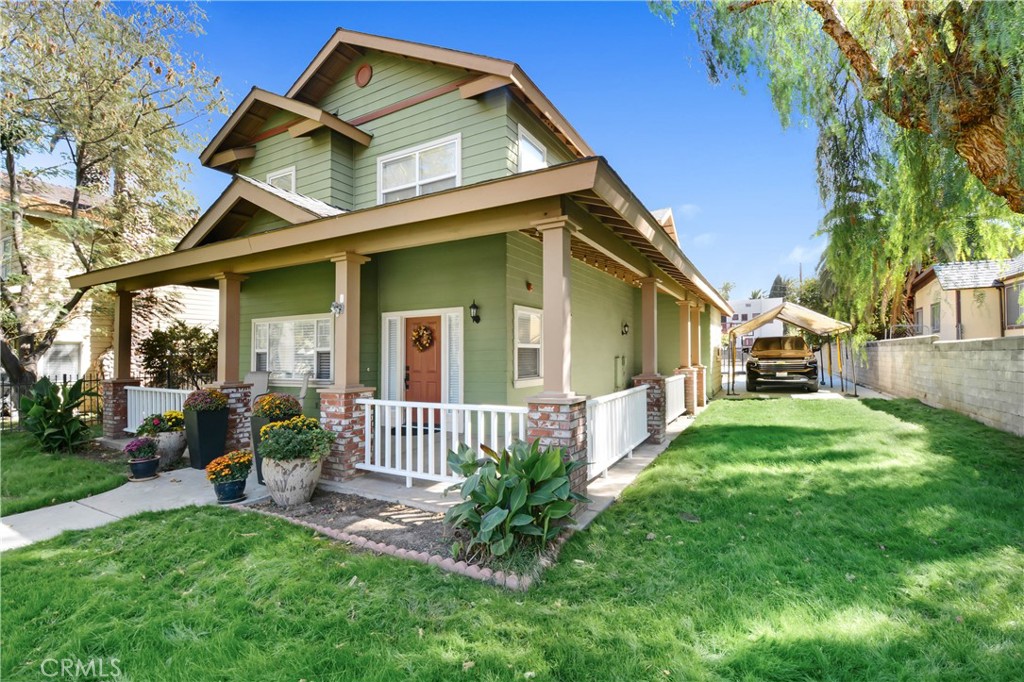 a front view of a house with garden