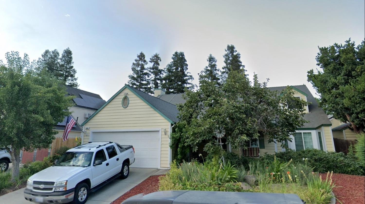 a view of a car in front of house