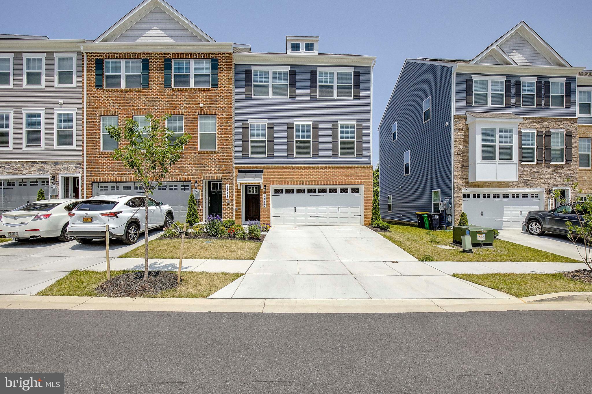 a view of building with cars parked