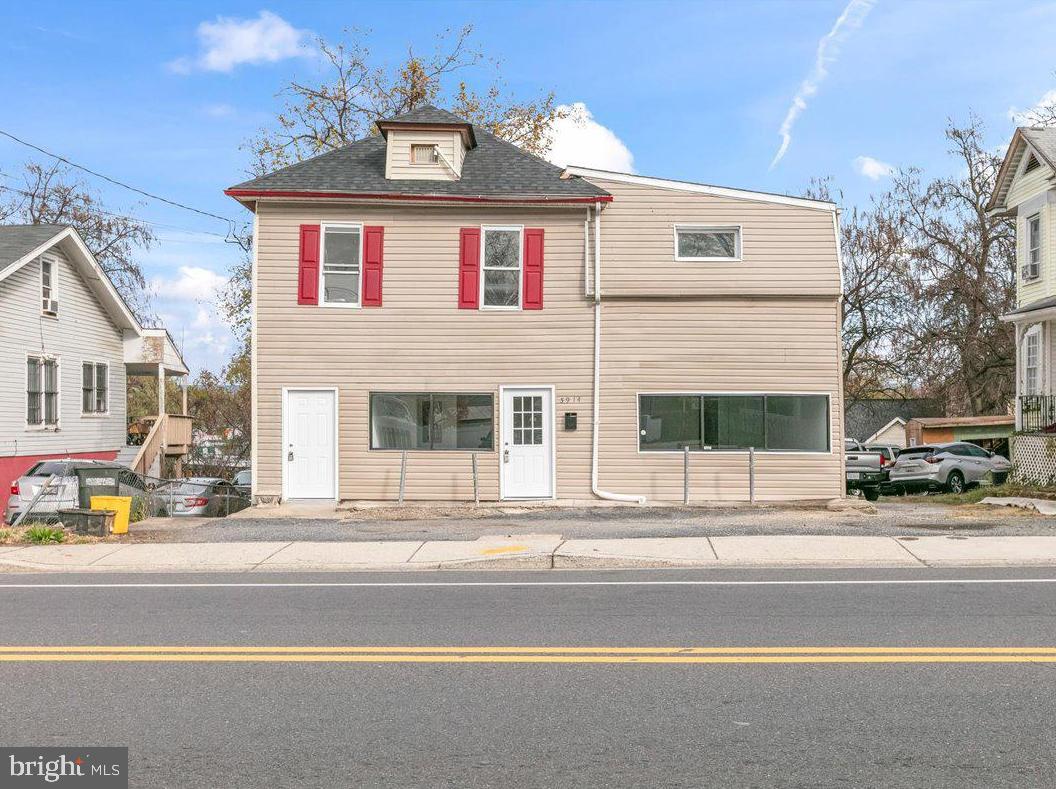 a view of a house with a street