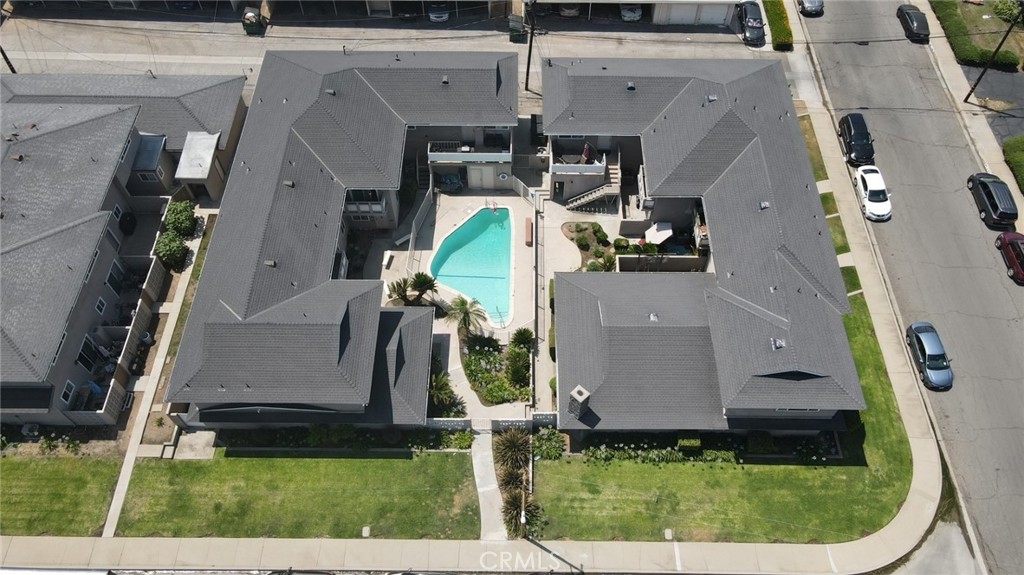 an aerial view of a house with a swimming pool