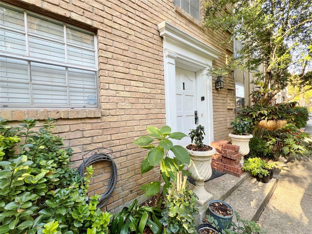 a front view of a house with outdoor seating