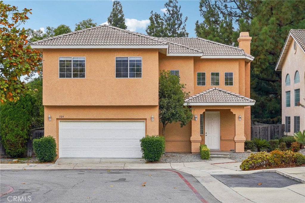 a front view of a house with yard