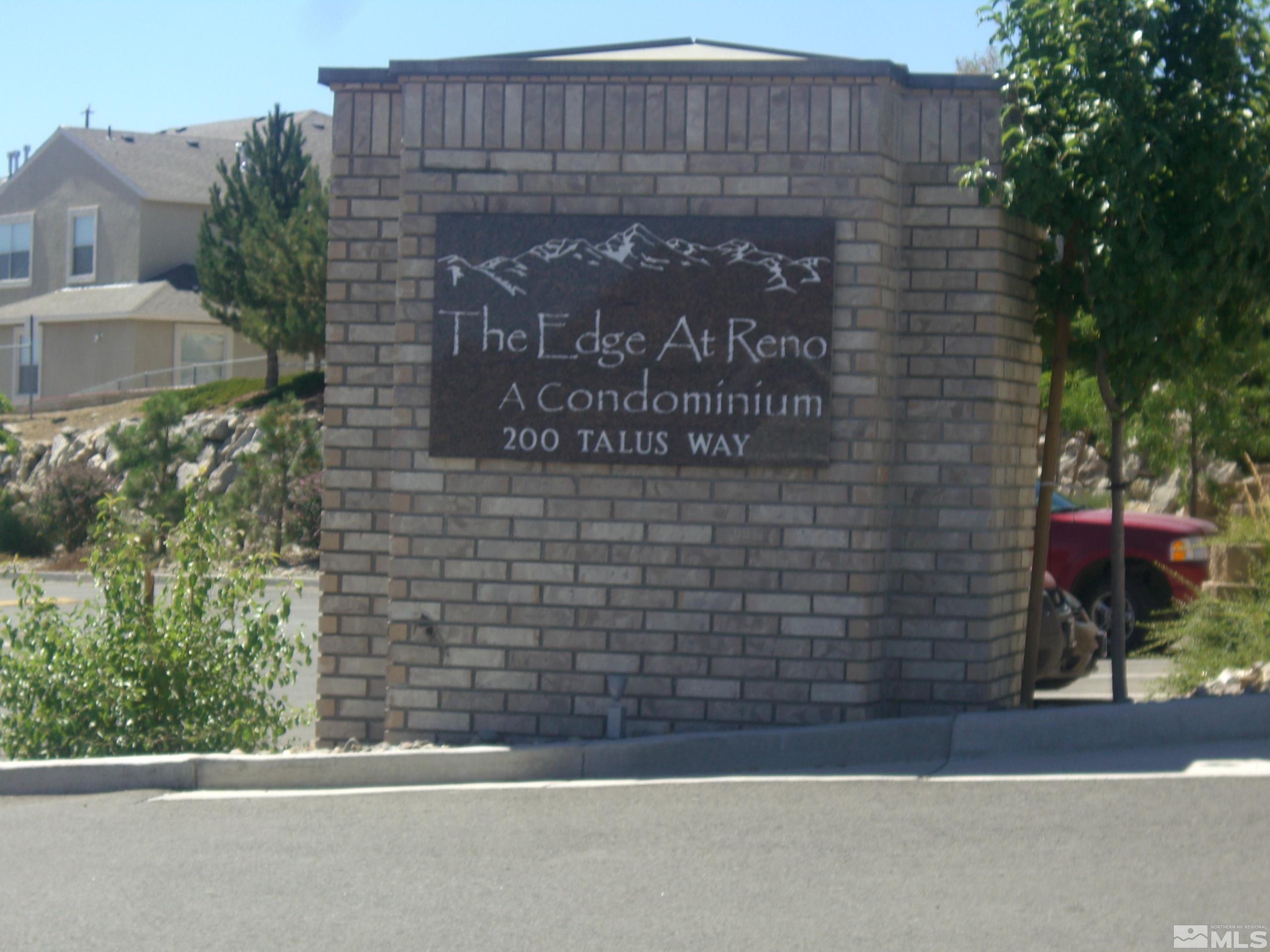 a brick building with a sign on it